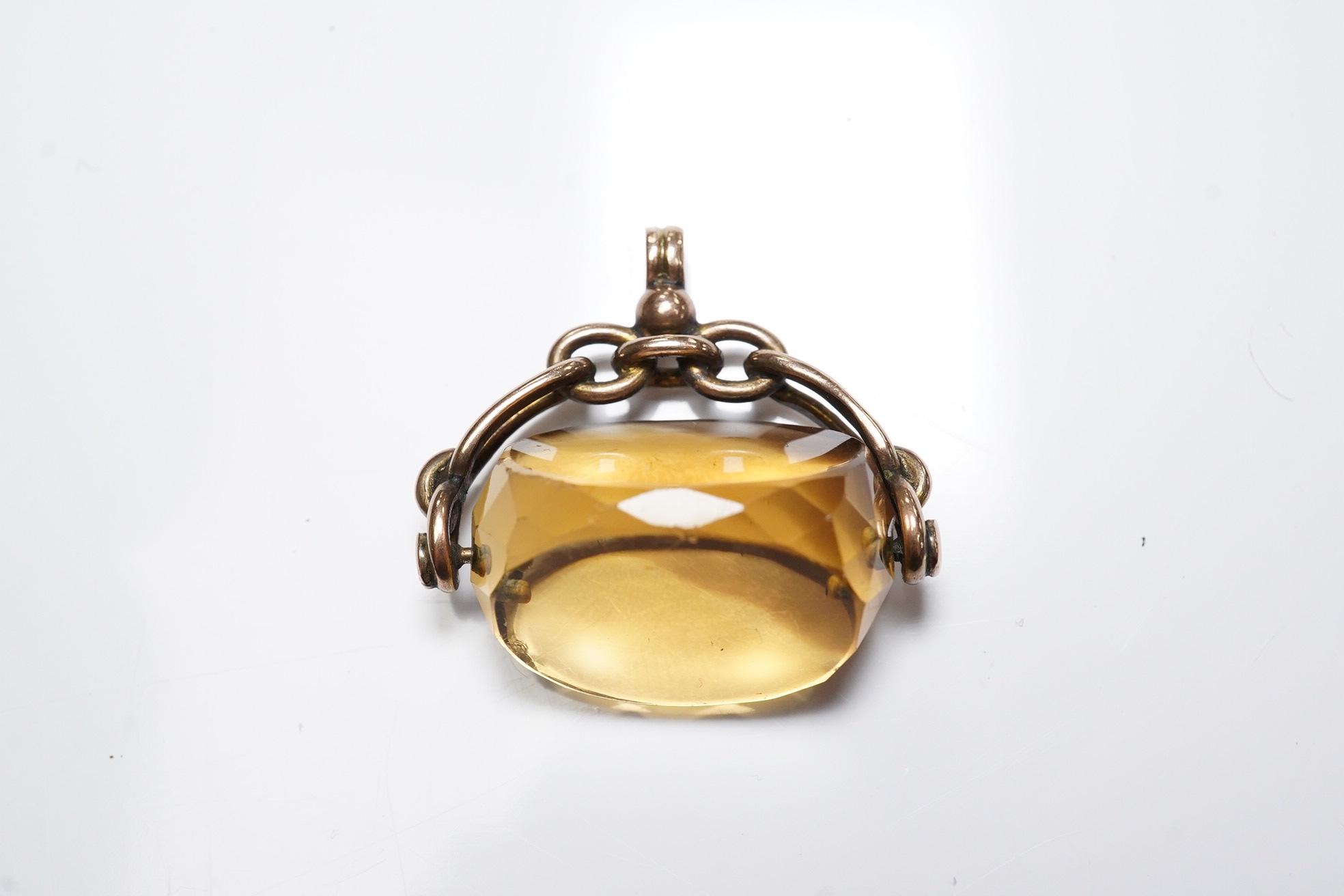 A George V 9ct gold mounted citrine spinning fob, 26mm, Condition - fair